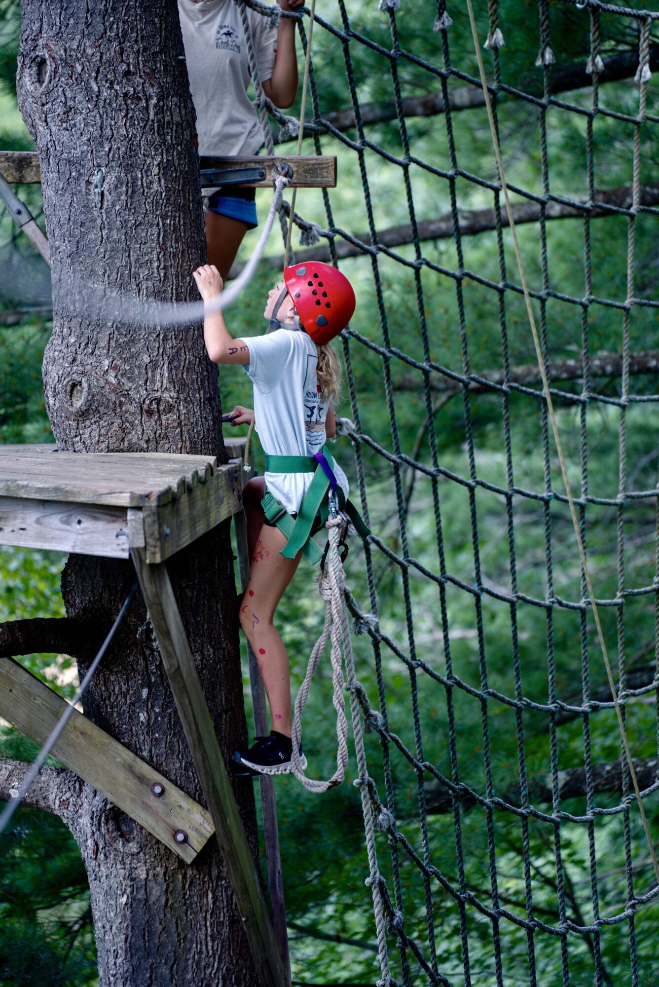 Flip Fest girl climbing ropes